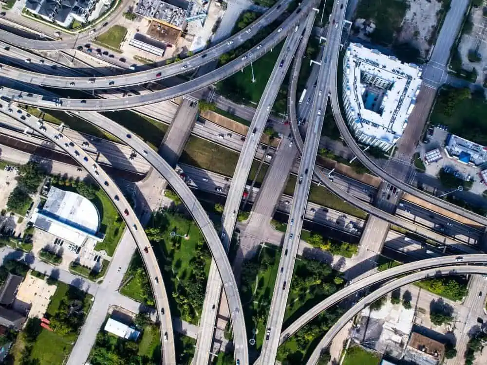 Cars driving on highway intersection from above in Houston Texas