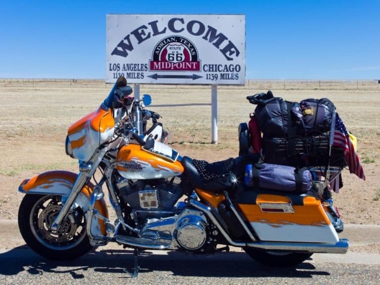 Motorcycle in front of Texas sign in Midpoint