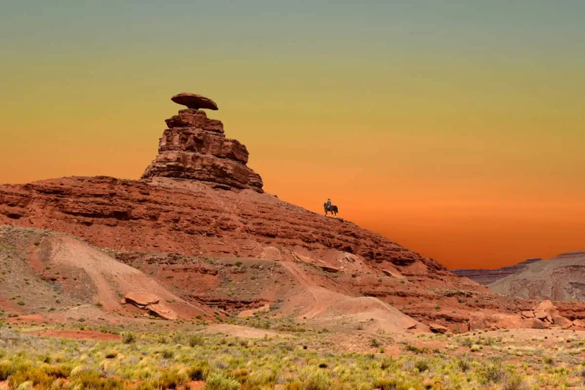 A Cowboy On Horseback Passes By Mexican Hat Rock In Mexican Hat Utah. - Texas News, Places, Food, Recreation, And Life.