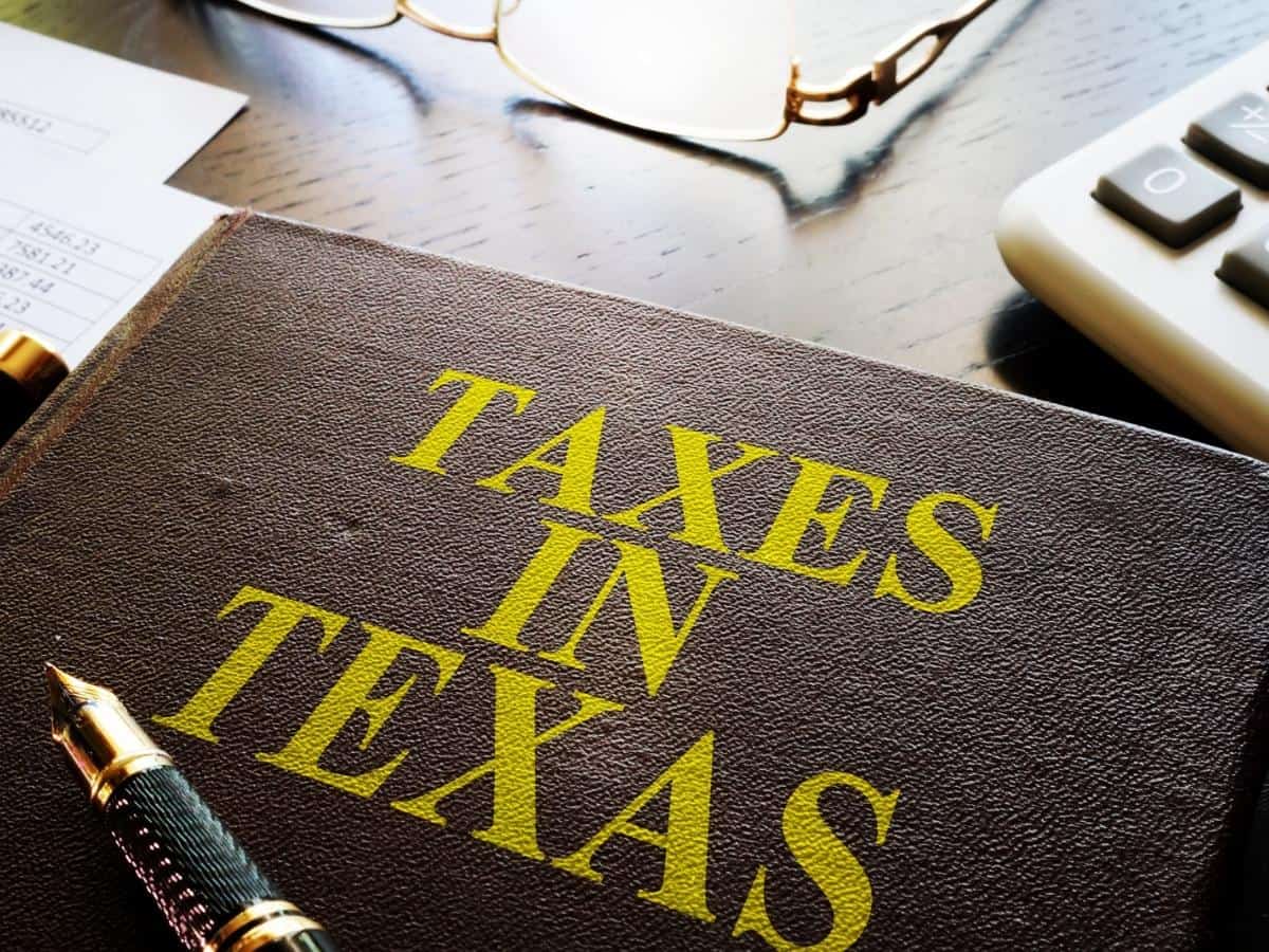 Book about Taxes in texas on an office table. - Texas View