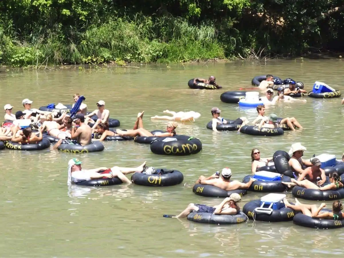 NEW BRAUNFELS TX – MAY 2009 Several people flowing down the Guadalupe River known for its large increased visitor traffic for the summer time. Tubers where taken on May 30th 2009 in New Braunfels - Texas View
