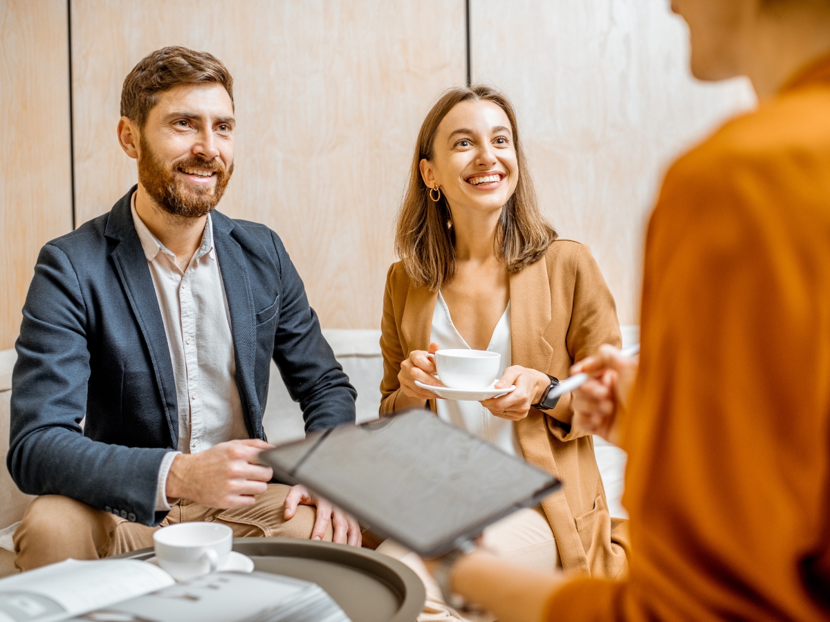 Young Couple with Sales Manager in the Office - Texas View