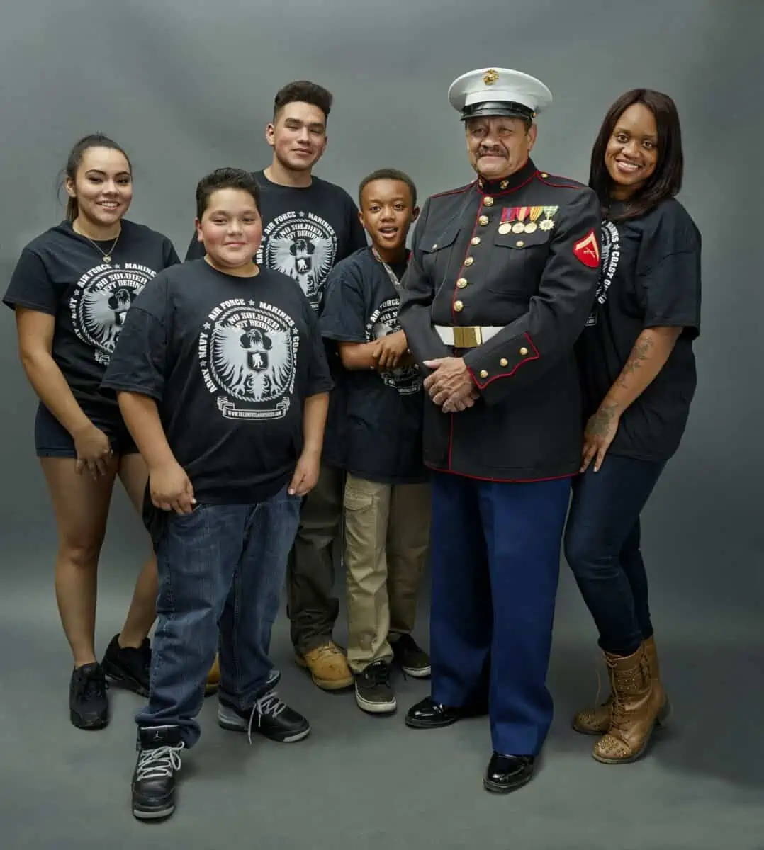 Former Marine Lance Corporal Manuel Valenzuela a member of the Jumano Native American Tribe photographed with family members in Pueblo Colorado at a gathering of North American Native People. - Texas View