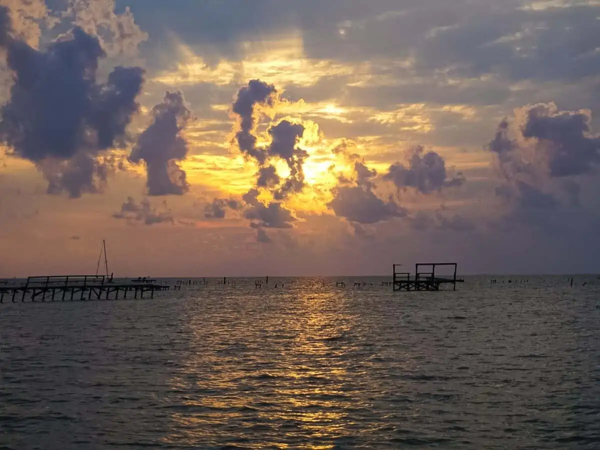 A Sunrise over the Bay with pier destruction in Rockport Texas after a hurricane - Texas View