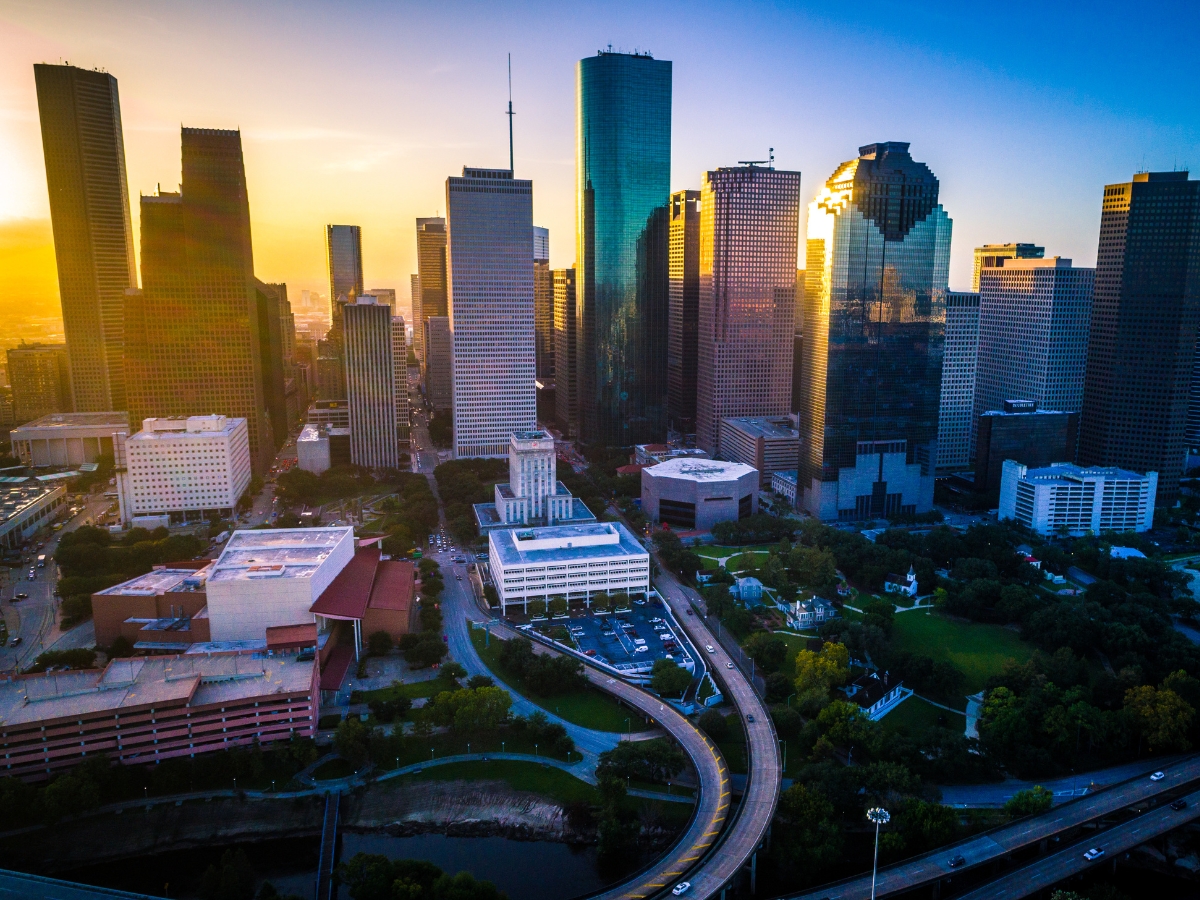 Golden sun beams aerial drone view Modern Rising Diverse City of Houston Texas USA Skyline Cityscape - Texas View