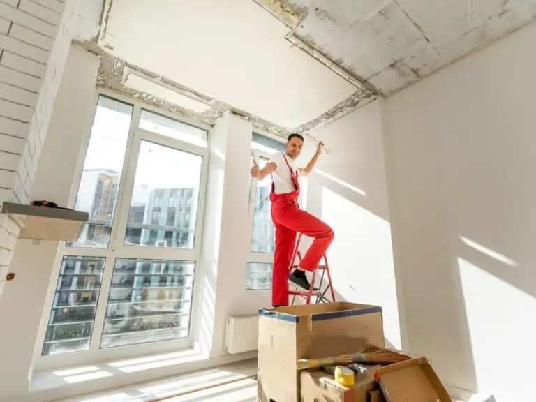 Technician of the air conditioning system is working on installing a new air conditioner in the apartment. - Texas View