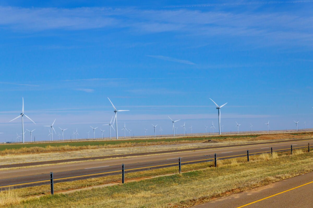 Wind generators at electric farm on Texas along with wind energy - Texas View
