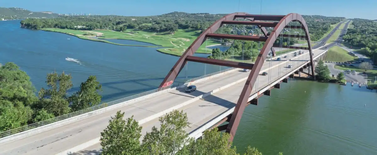 Panorama elevated view of Pennybacker Bridge or 360 Bridge. A landmark in Austin Texas USA. Top of Town Lake Colorado River and Hill Country green landscape - Texas View