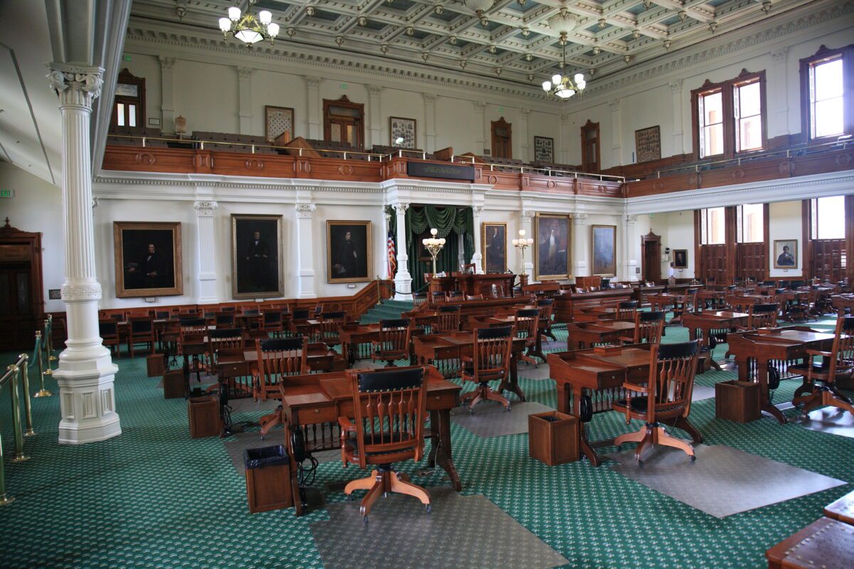 Desks and chairs in the historic senate chamber located in the Texas Capitol building. - Texas View