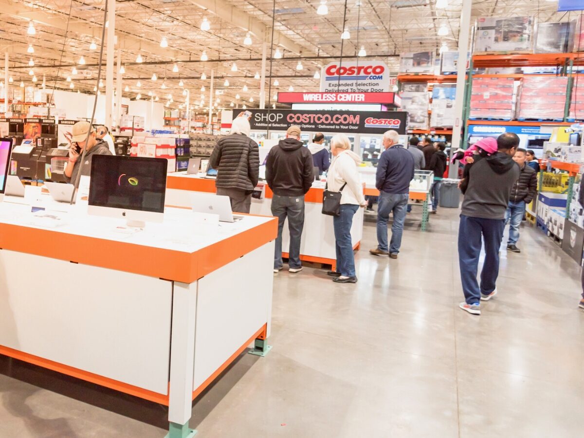 LEWISVILLE TEXAS USA NOV 29 2019 Electronics department and wireless center at Costco with busy customer browsing and buying special deal on Black Friday shopping vent. - Texas View