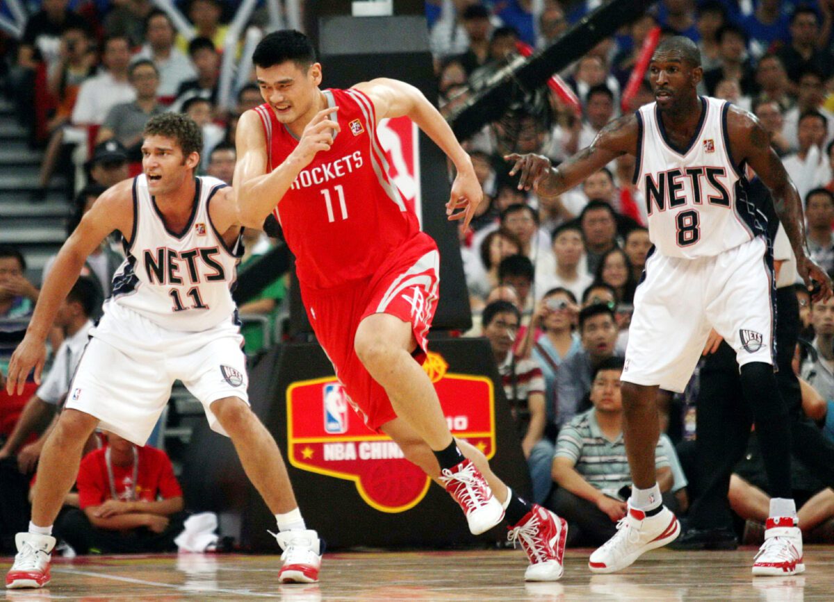 Yao Ming center of the Houston Rockets runs through Brook Lopez - Texas View
