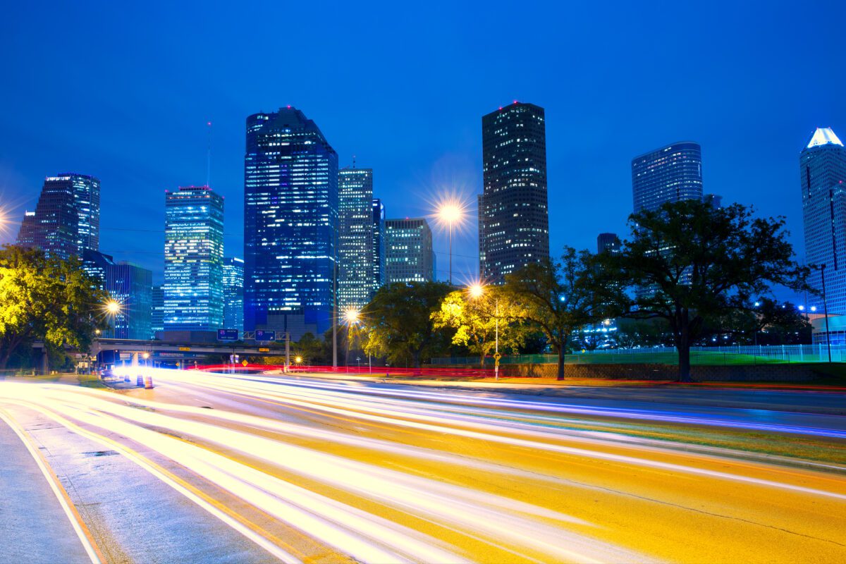 Houston Texas skyline at sunset with traffic lights - Texas News, Places, Food, Recreation, and Life.