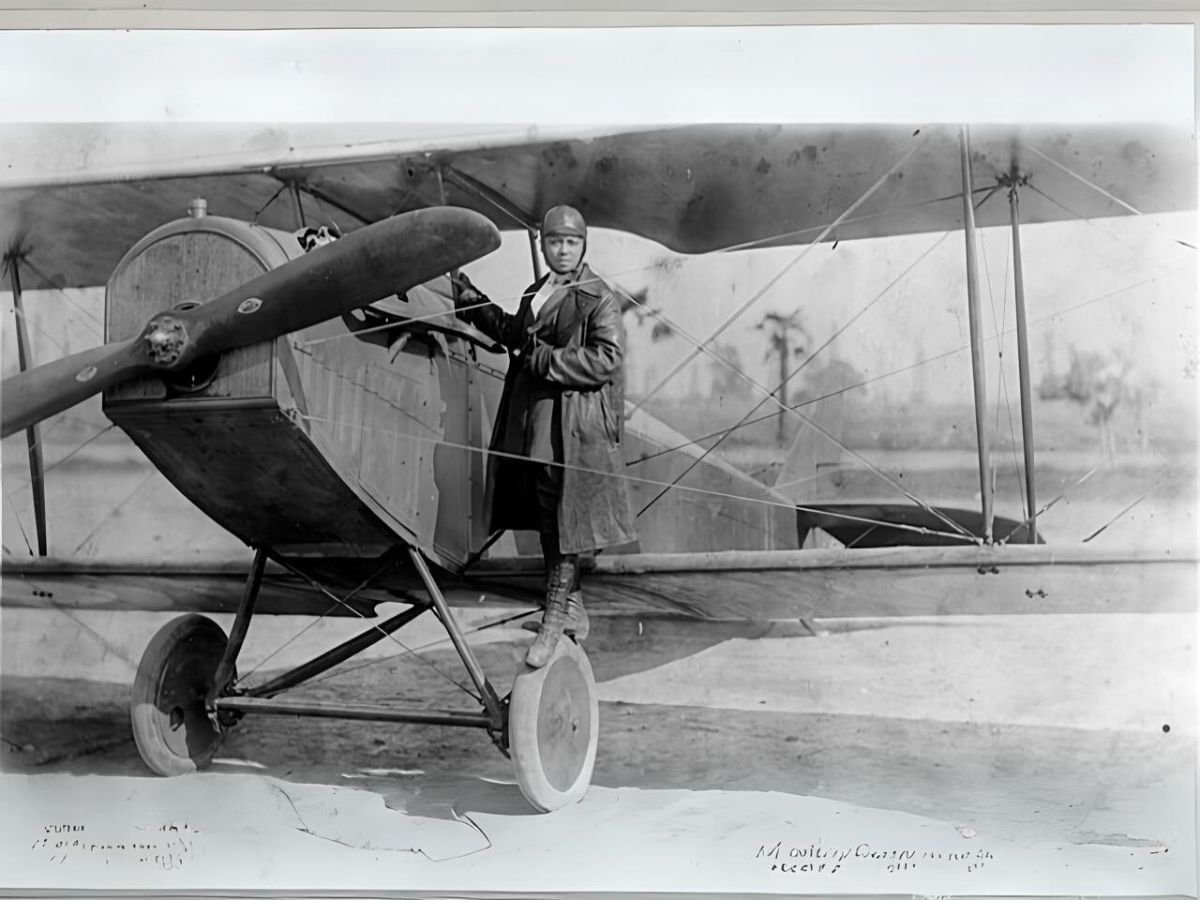 Bessie Coleman on a wing of a plane - Texas View