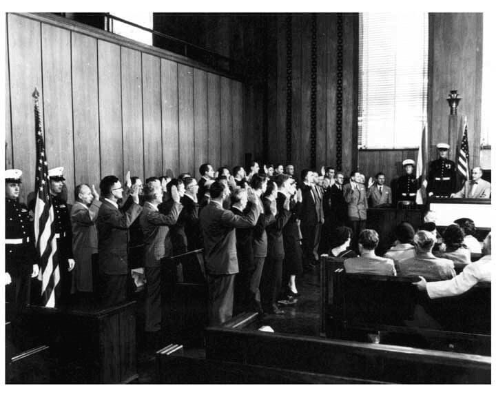 	Thirty-nine of the German-born scientists at the U.S. Redstone Arsenal, along with the wives of two of the Operation Paperclip group, were sworn in as U.S. citizens at a 1954 naturalization ceremony.
