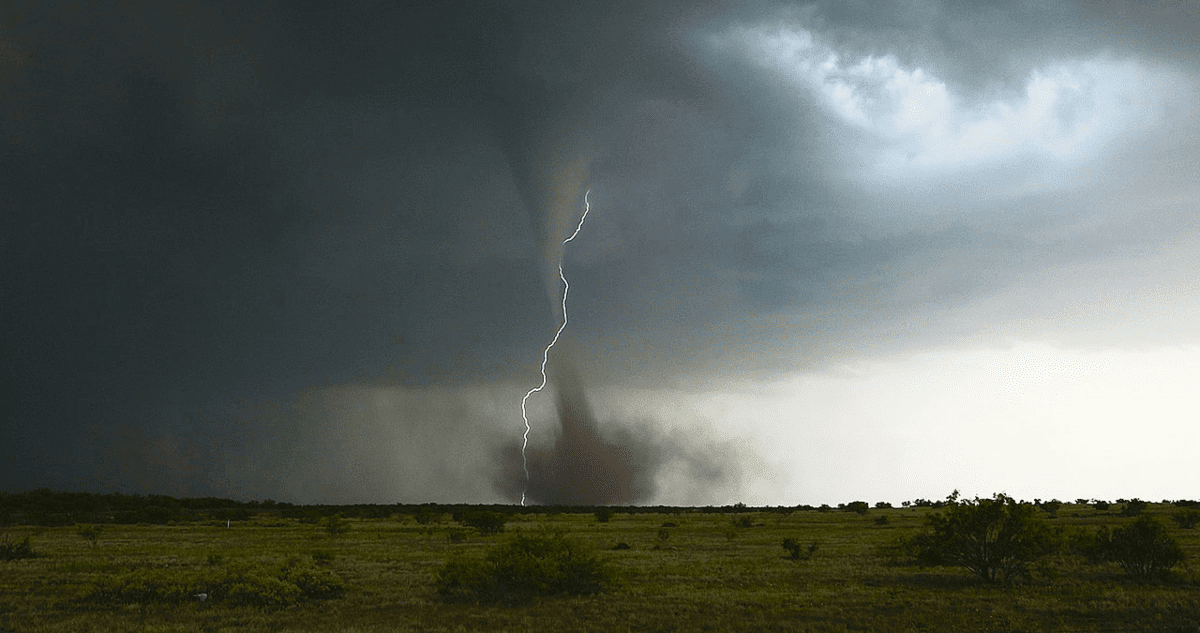 Lightning snakes around an anticyclonic tornado in Big Spring, Texas on May 22, 2016. Captured by storm chaser Aaron Jayjack