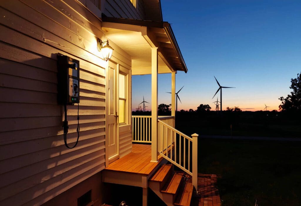 porch of a home at night with lights on 