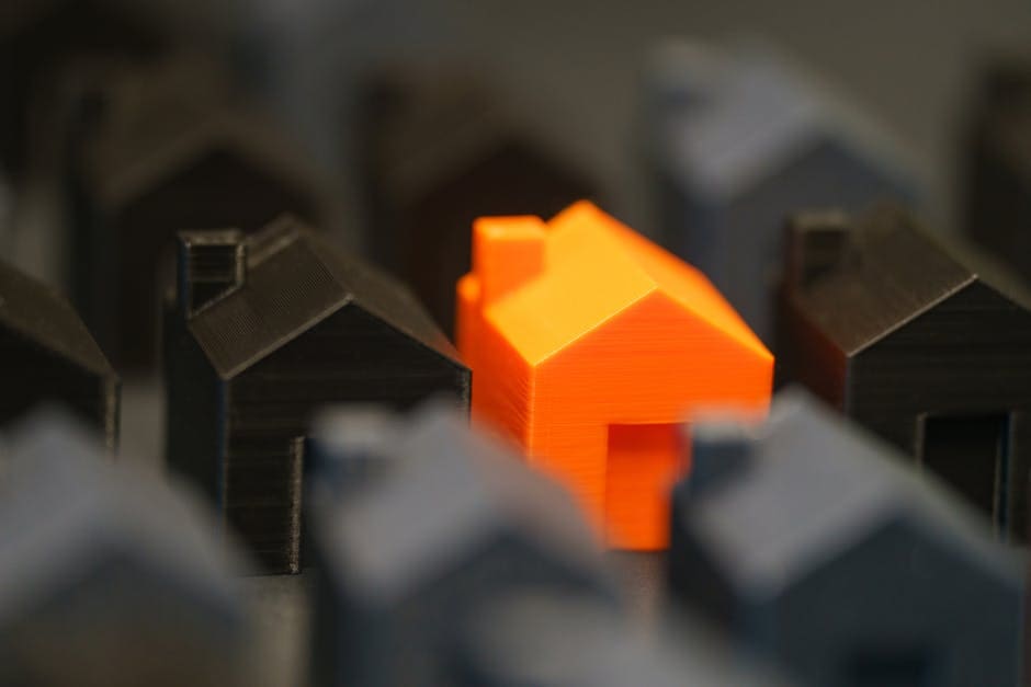Standout Property Real Estate Market Concept Orange Miniature House Model