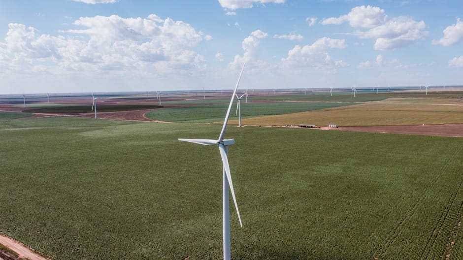 Expansive aerial view of wind turbines over green fields in Groom, Texas, showcasing renewable energy.